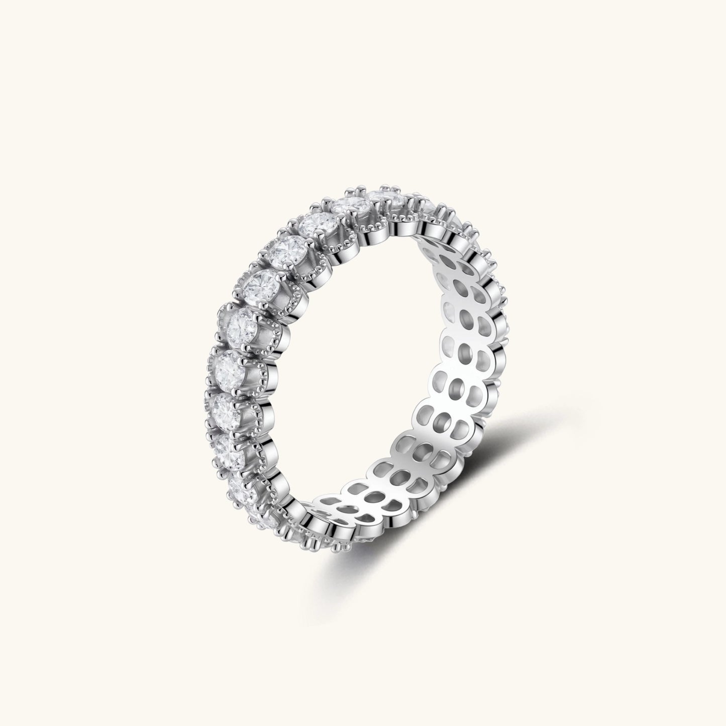 Sterling silver eternity ring with continuous row of brilliant moissanite stones in scalloped crown setting with milgrain detail